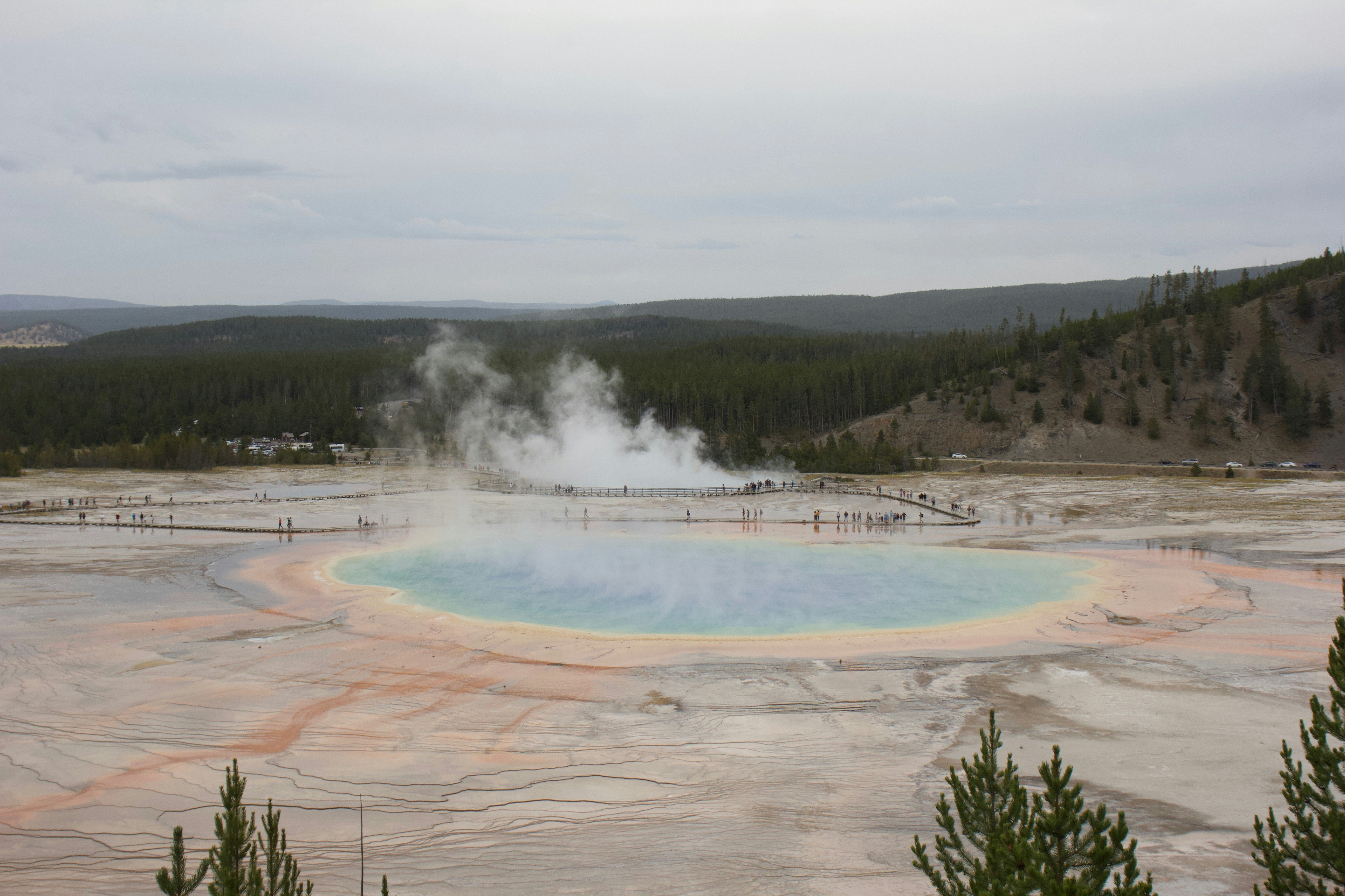 white clouds over brown field hot spring zoom background
