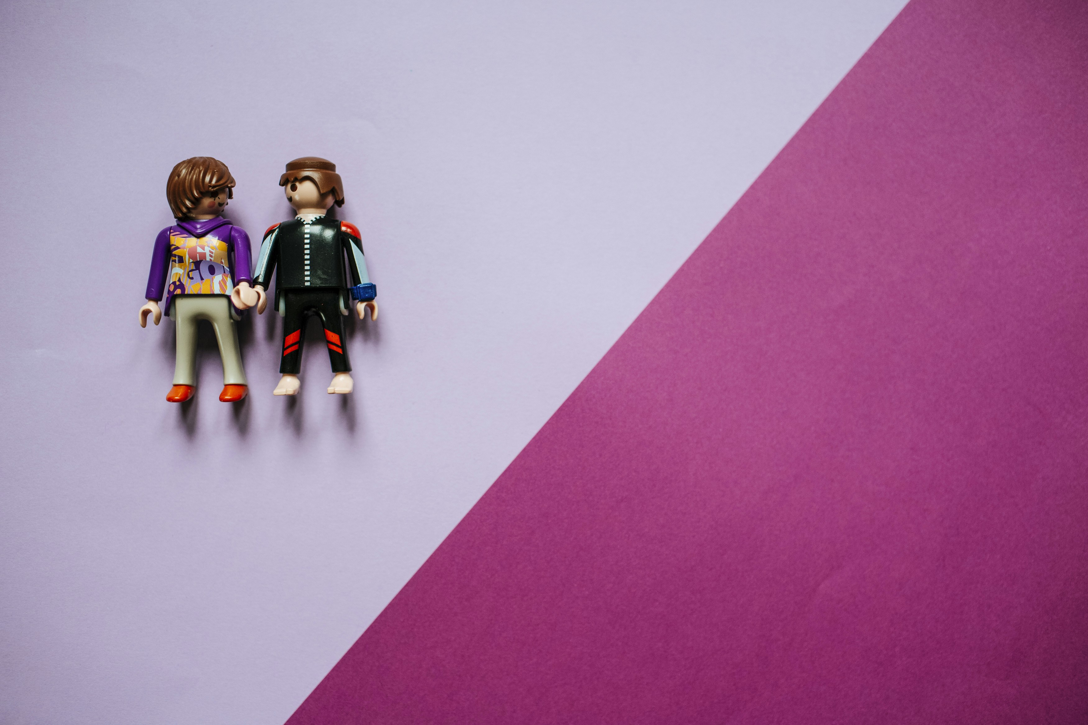 3 children in black and blue suit action figures symbolic teams background