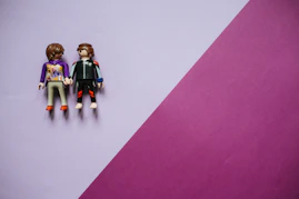 3 children in black and blue suit action figures