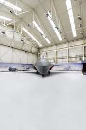 white airplane in a white room