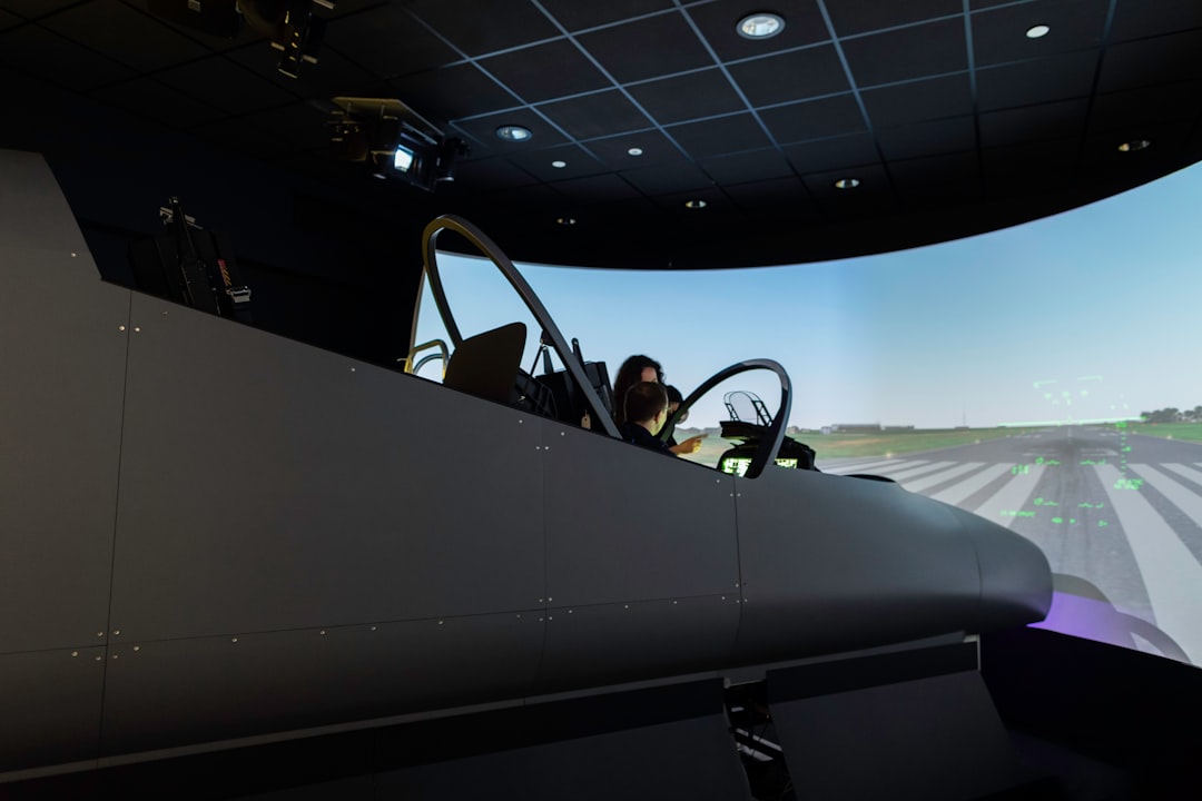 man in black jacket riding black convertible car, Female aerospace engineer conducts flight simulator