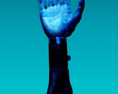 person holding blue light bulb