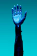 blue robotic prosthetic hand against teal background