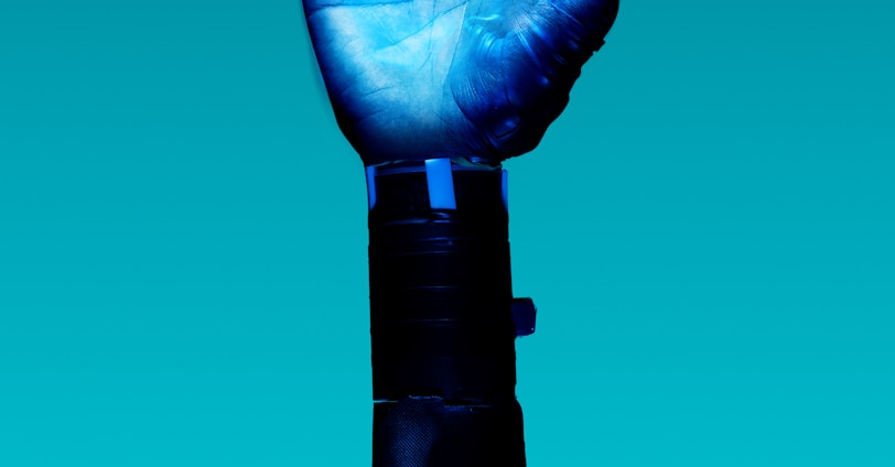 person holding blue light bulb