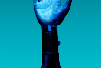 person holding blue light bulb