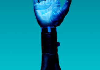 person holding blue light bulb