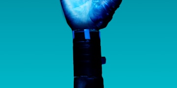 person holding blue light bulb