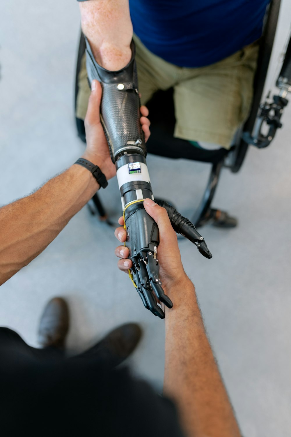 person holding black and silver tube