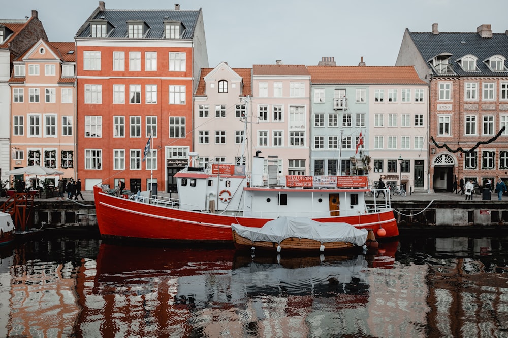 red and white boat on water