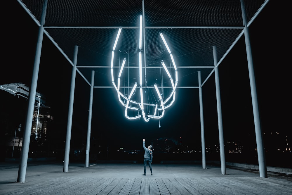 person standing on white metal frame