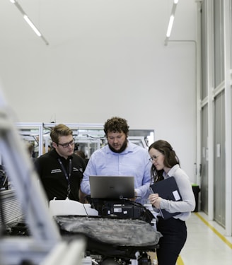 group of people sitting on chair in front of table with laptop computers