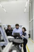 group of people sitting on chair in front of table with laptop computers