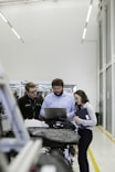 group of people sitting on chair in front of table with laptop computers