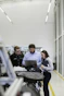group of people sitting on chair in front of table with laptop computers