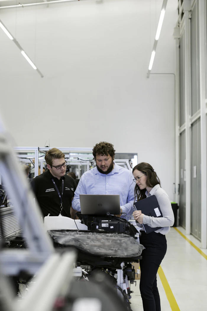 Group technical training session with laptops