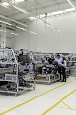 man training 2 people on automation