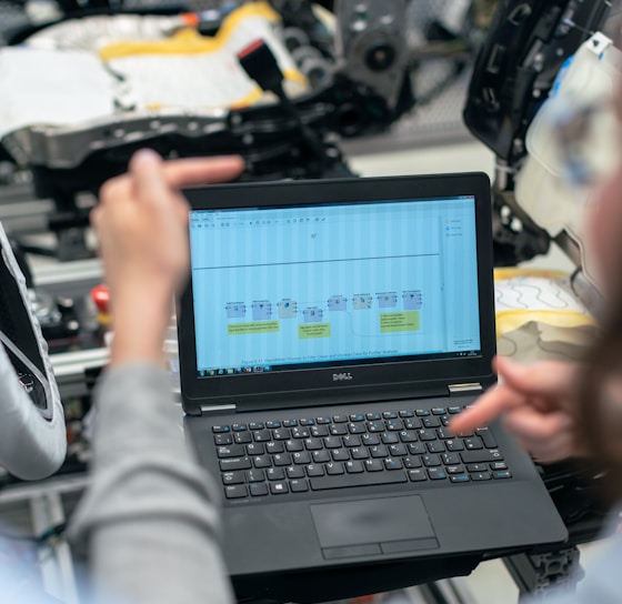 black laptop computer on table