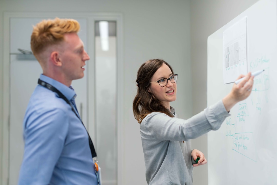 A woman explains to her colleague how shortening the sales cycle accelerates revenue, emphasizing the importance of efficiency and speed in driving business growth.