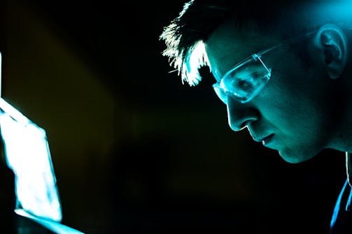 man in black framed eyeglasses