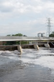 gray concrete bridge under white sky during daytime