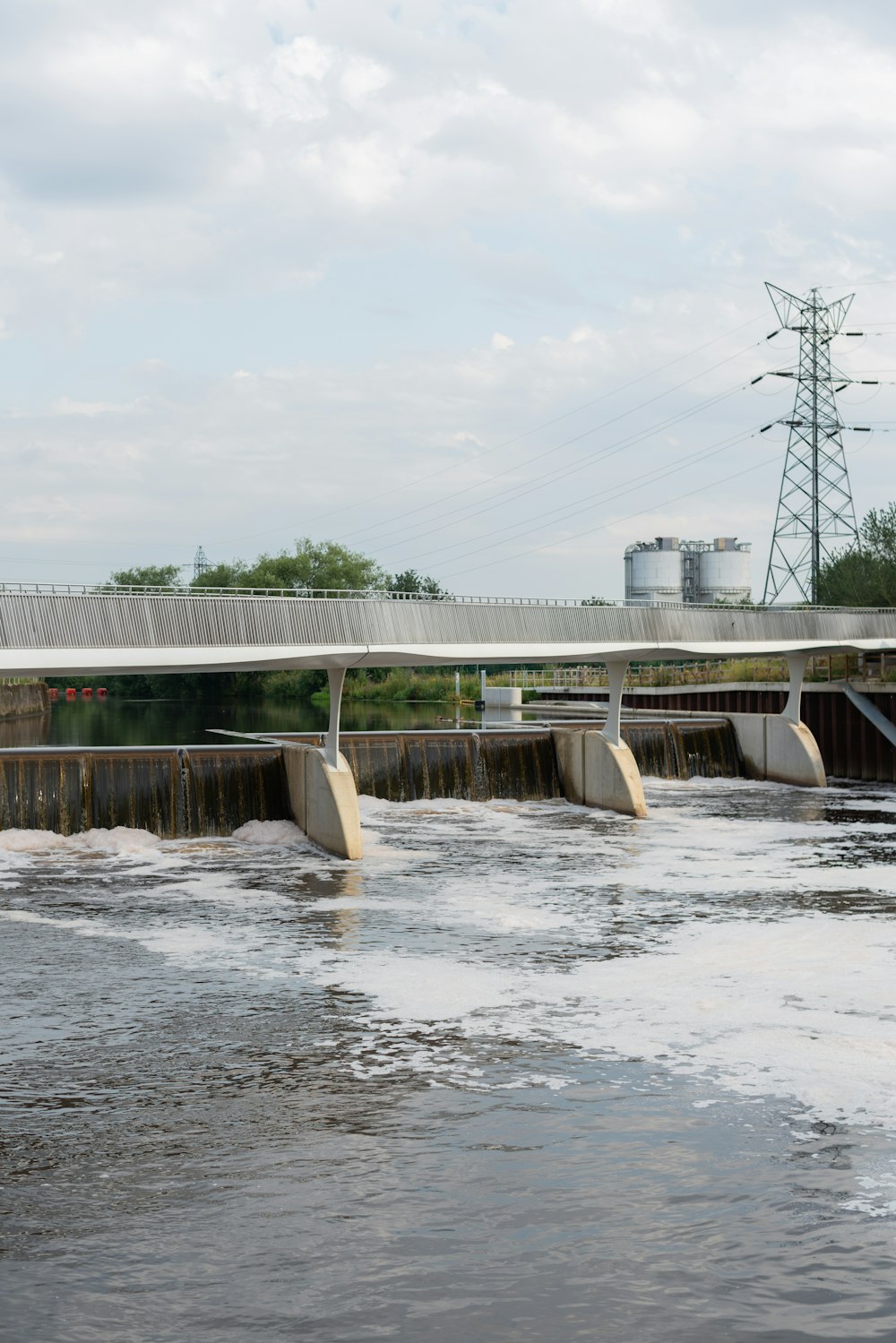 gray concrete bridge under white sky during daytime