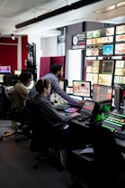man in black and white checkered dress shirt sitting on black office rolling chair