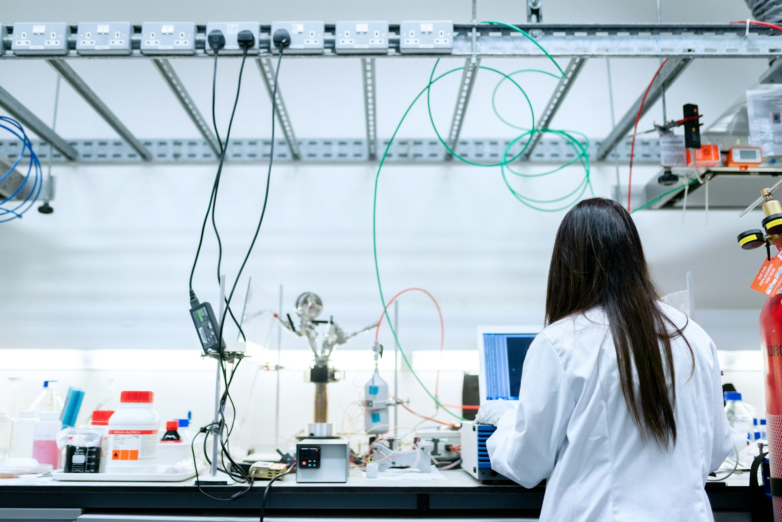 A scientist working with instruments in a biotechnology laboratory