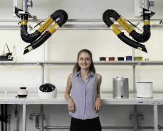 woman in blue sleeveless shirt holding black and yellow power tool