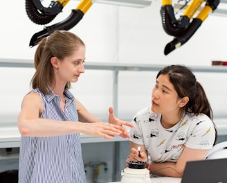 woman in white and blue stripe tank top holding black and yellow power tool