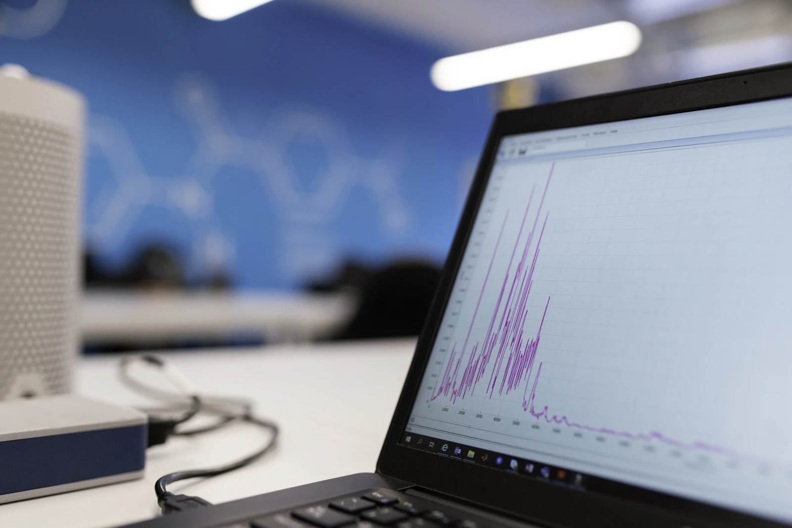 Engineer working with data on a laptop