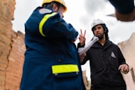 Engineers discussing plans at a project site.