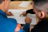 person writing on white paper