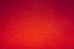 red painted wall in close up photography
