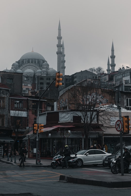 cars parked near building during daytime in Süleymaniye Mosque Turkey