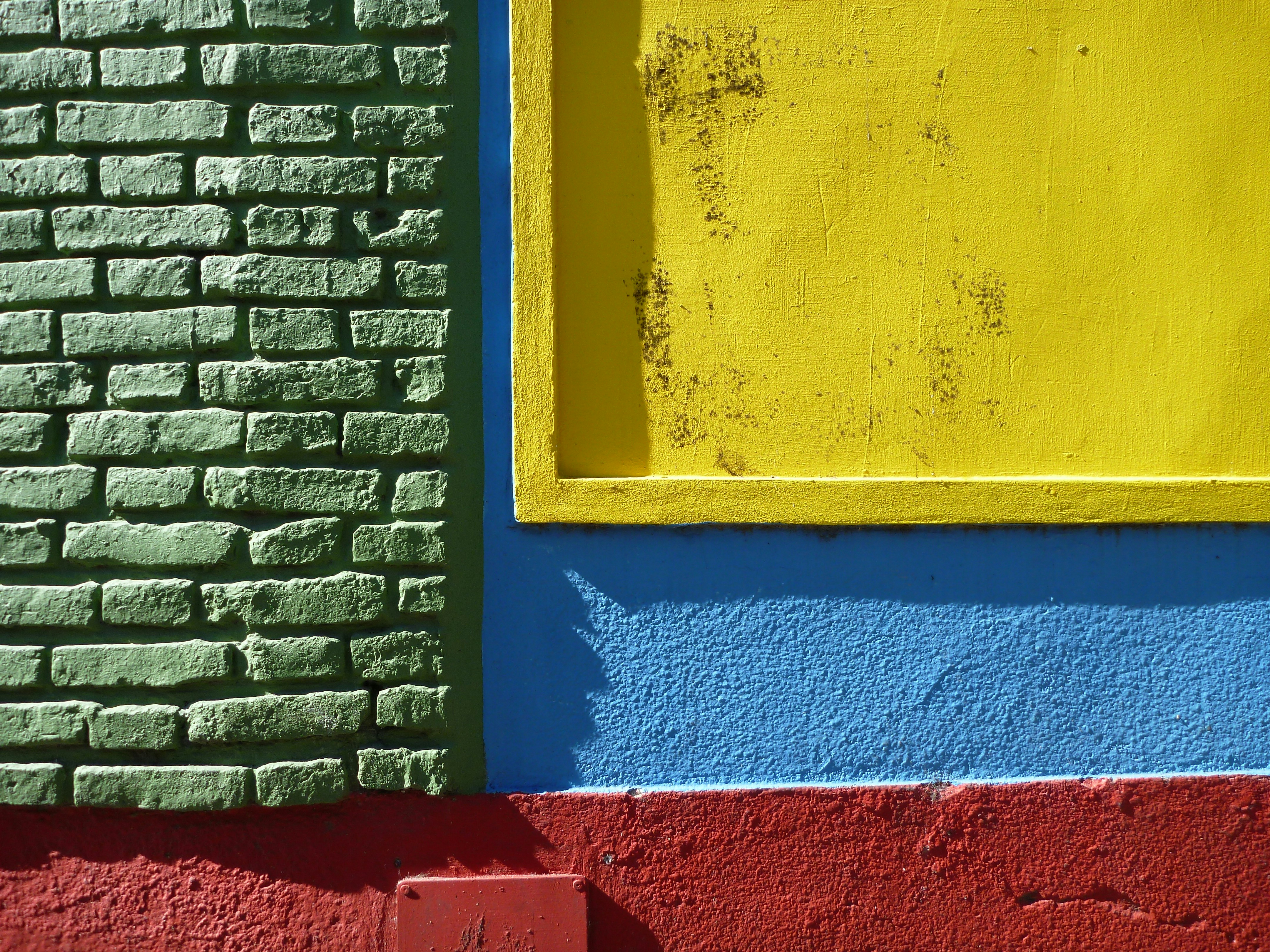 yellow and red concrete brick wall