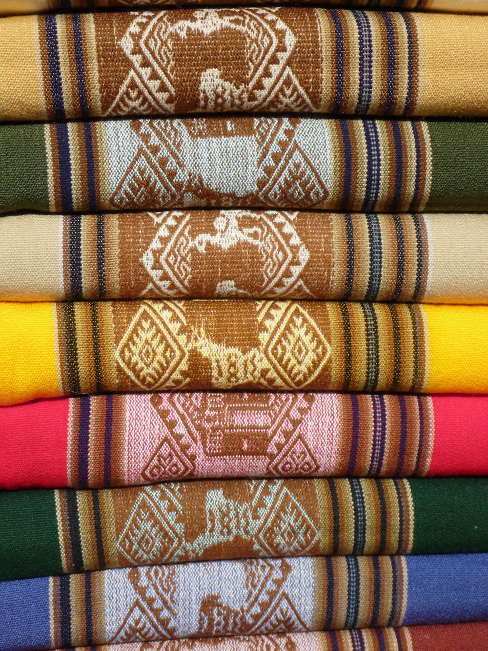 red green and brown textile