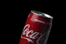 coca cola can on black background