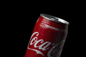coca cola can on black background