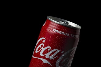 coca cola can on black background
