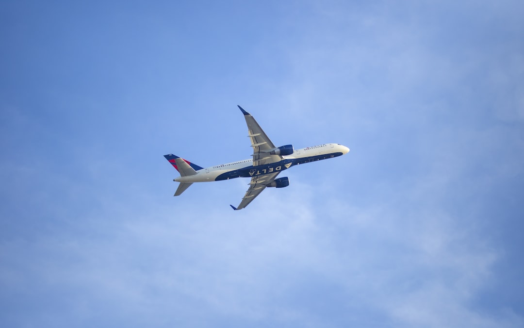 white and red airplane in the sky, Delta Airlines taking off! Caught from the cell phone lot at Hartsfield-Jackson Atlan