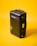 A black hard-shell protective case labeled 'Pelican Air' stands upright against a bright yellow background. The case features robust construction with secure clasps and a handle on the side.