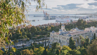 white concrete building near body of water during daytime