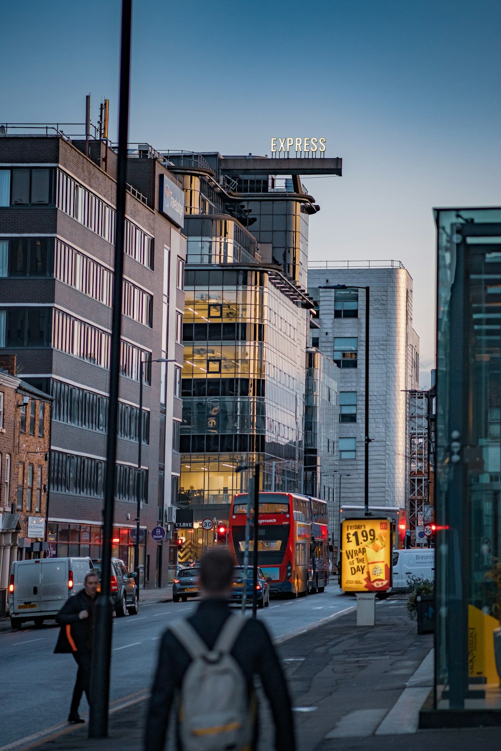 people walking on pedestrian lane near buildings during daytime