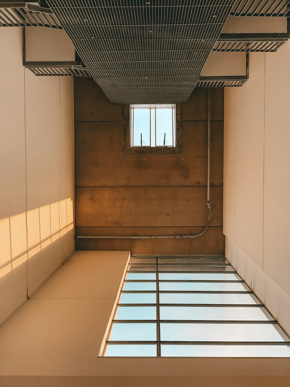 white and brown tiled hallway