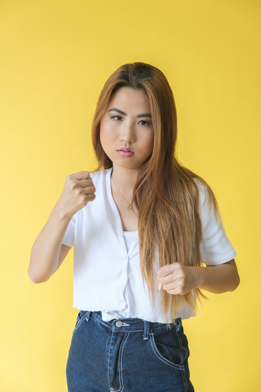 woman in white shirt and blue denim shorts