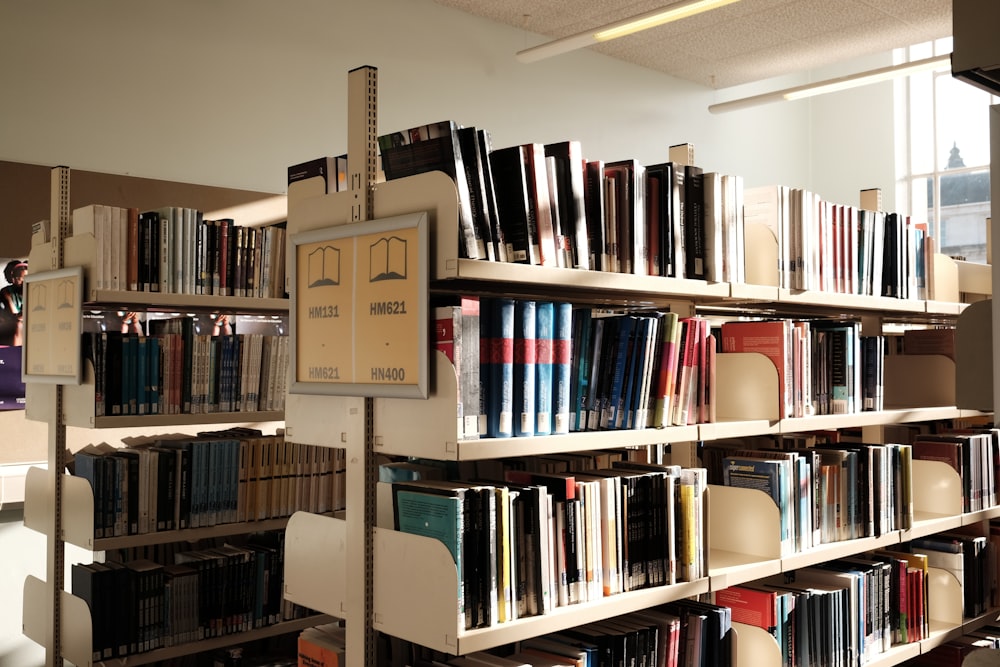 brown wooden book shelf with books