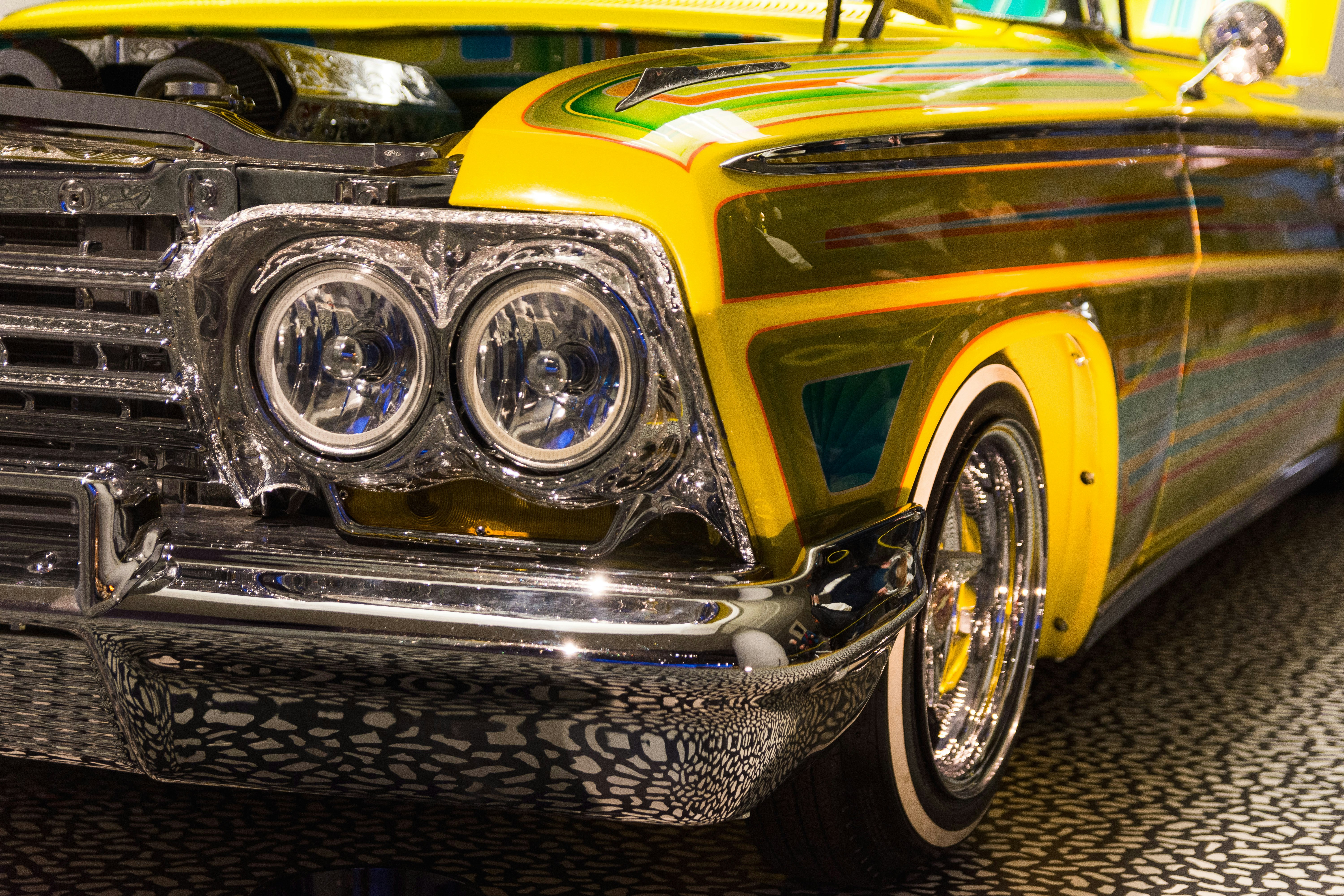 yellow and black car on black and white textile