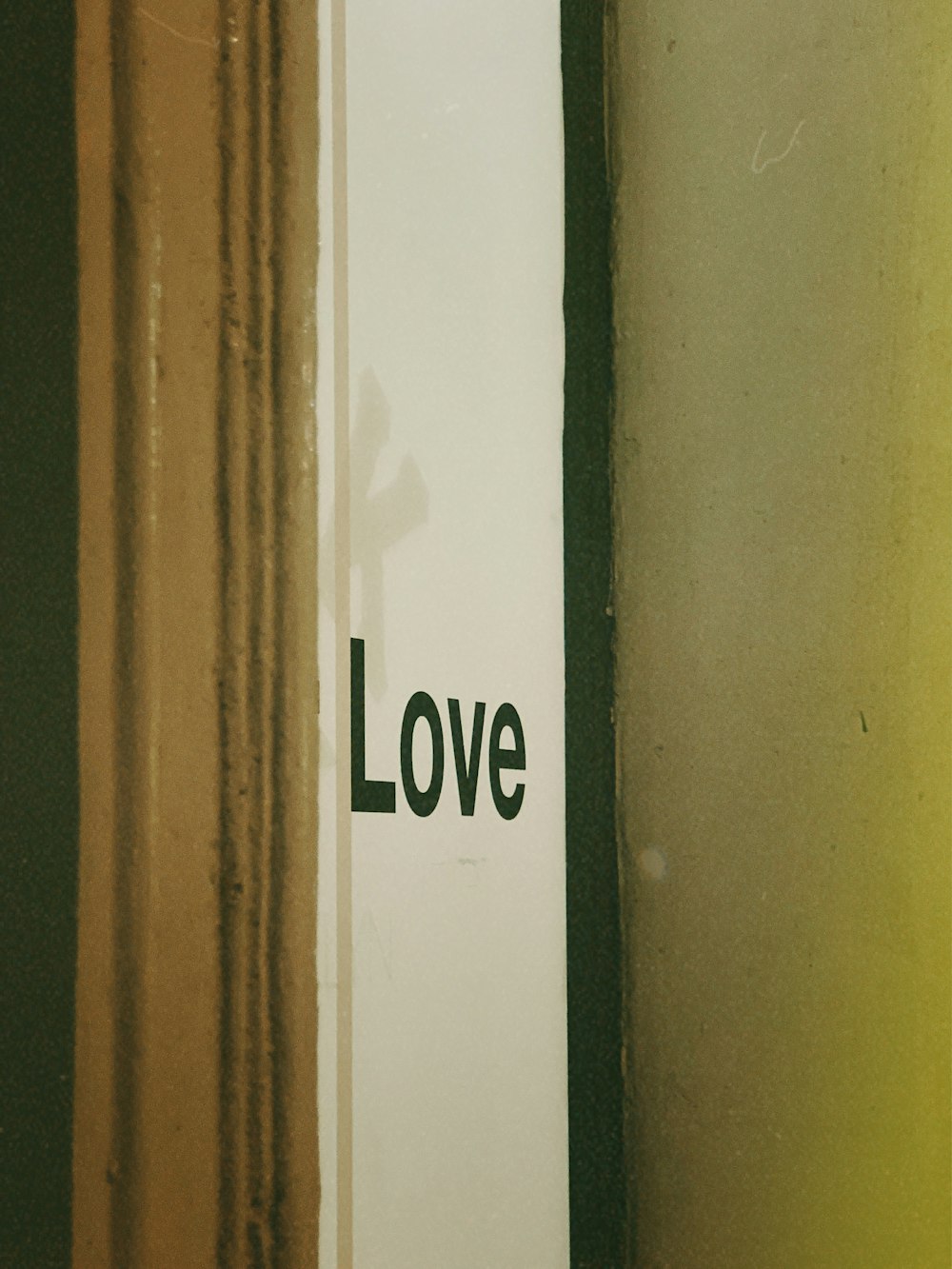 a close up of a sign with the word love on it