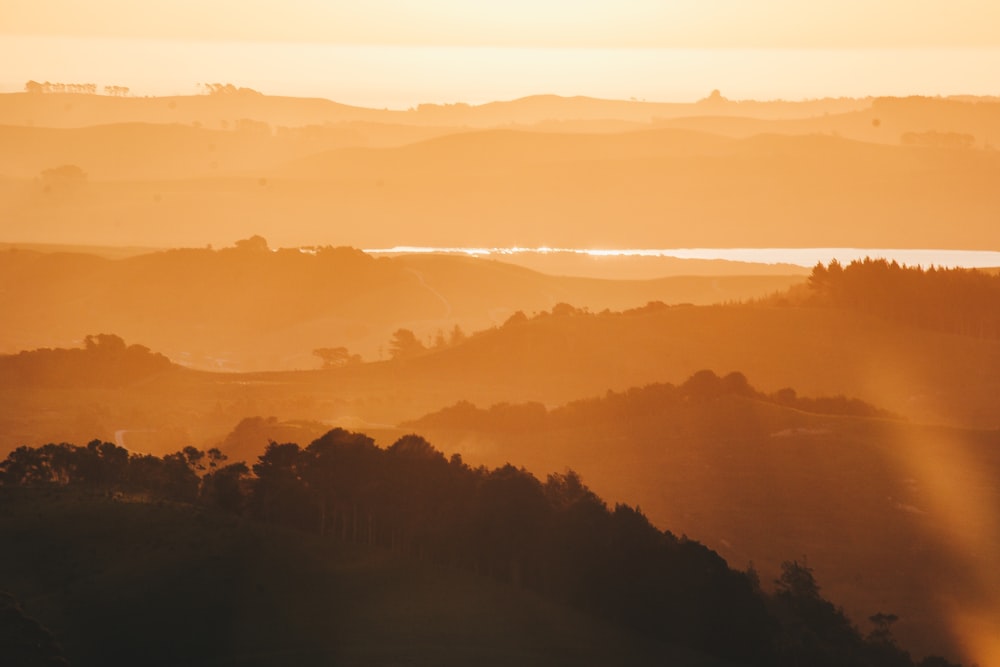 silhouette of mountains during sunset