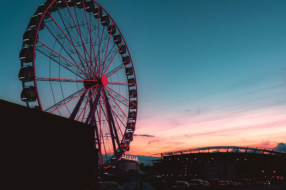 ferris wheel under blue sky during sunset